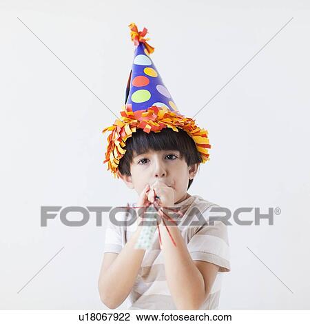 Studio Shot of young boy with hat on his head View Large Photo Image Stock Image - Studio Shot of young boy with hat on his head. Fotosearch