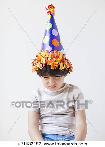 Studio Shot of young boy with hat on his head View Large Photo Image Stock Image - Studio Shot of young boy with hat on his head. Fotosearch