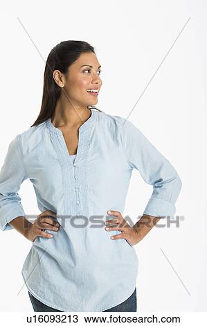 Studio shot of young woman smiling View Large Photo Image Stock Image - Studio shot of young woman smiling. Fotosearch