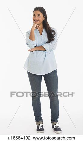 Stock Image - Studio shot of young woman smiling. Fotosearch