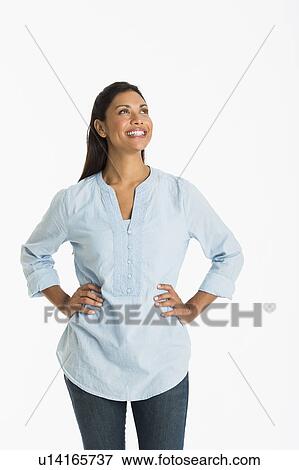 Studio shot of young woman smiling View Large Photo Image Stock Photo - Studio shot of young woman smiling. Fotosearch