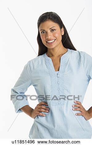 Stock Photograph - Studio shot of young woman smiling. Fotosearch