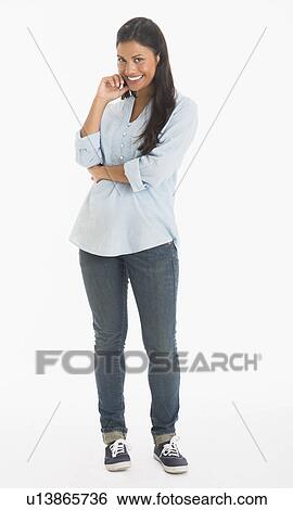 Stock Photograph - Studio shot of young woman smiling. Fotosearch