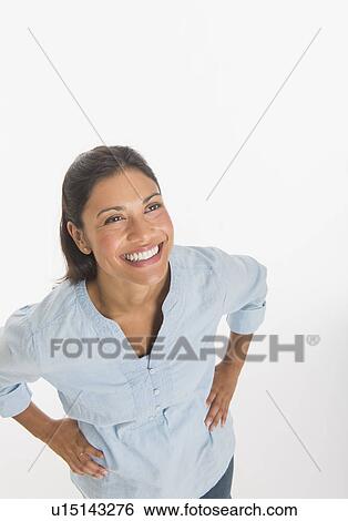 Studio shot of young woman smiling View Large Photo Image Stock Photograph - Studio shot of young woman smiling. Fotosearch