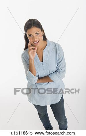 Stock Photography - Studio shot of young woman smiling. Fotosearch