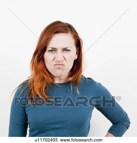 Stock Image - Studio shot, Portrait of angry woman. Fotosearch