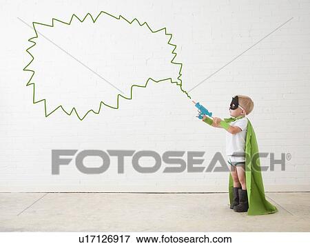 Studio shot, Portrait of boy (2-5 years) wearing green cape and holding his toy gun View Large Photo Image Stock Photo - Studio shot, Portrait of boy (2-5 years) wearing green cape and holding his toy gun. Fotosearch
