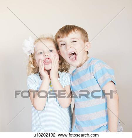 Studio Shot, Portrait of girl and boy making faces View Large Photo Image Stock Image - Studio Shot, Portrait of girl and boy making faces. Fotosearch