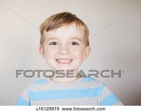 Studio Shot, Portrait of smiling boy View Large Photo Image Stock Photo - Studio Shot, Portrait of smiling boy. Fotosearch