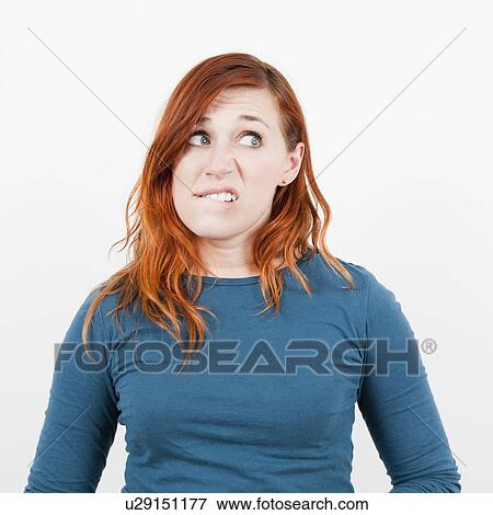 Studio shot, Portrait of woman being surprised View Large Photo Image Stock Photo - Studio shot, Portrait of woman being surprised. Fotosearch
