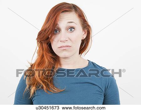 Studio Shot, Portrait of woman grimacing View Large Photo Image Stock Image - Studio Shot, Portrait of woman grimacing. Fotosearch