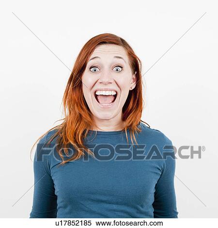 Stock Photography - Studio Shot, Portrait of woman laughing . Fotosearch