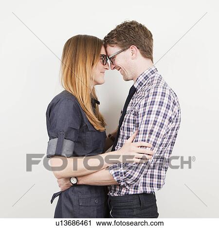 Studio Shot, portrait of young couple View Large Photo Image Stock Image - Studio Shot, portrait of young couple. Fotosearch