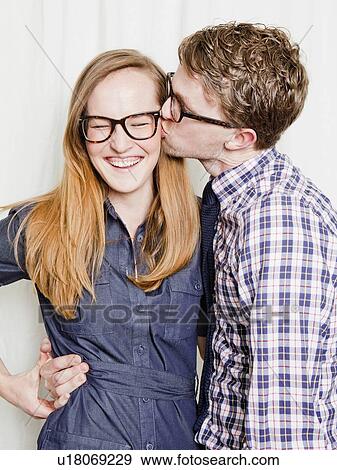 Stock Photo - Studio Shot, portrait of young couple. Fotosearch