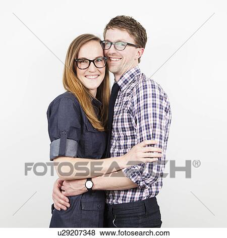 Studio Shot, portrait of young couple embracing View Large Photo Image Stock Photo - Studio Shot, portrait of young couple embracing. Fotosearch