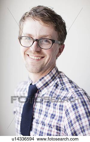 Picture - Studio Shot, portrait of young man smiling. Fotosearch