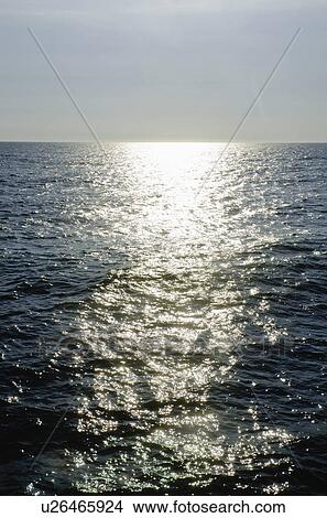 sunlight reflecting on sea View Large Photo Image Picture - sunlight reflecting on sea. Fotosearch