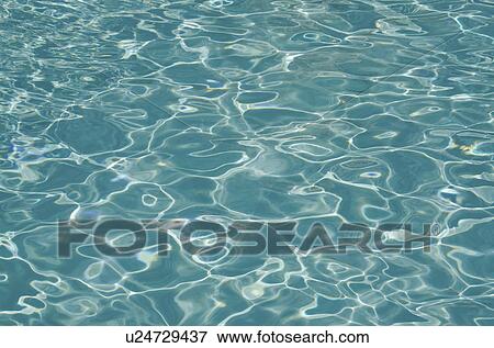 Stock Photo - Surface of rippled water on swimming pool. Fotosearch