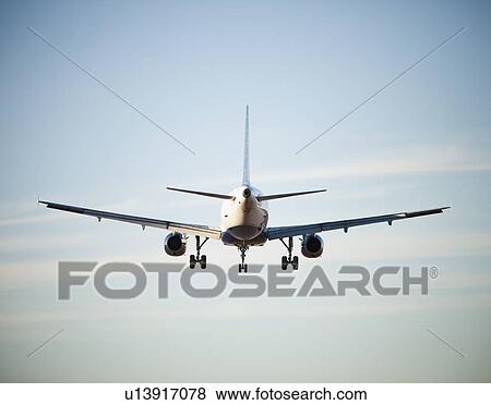 Stock Photo - Tale end of jet airliner flying. Fotosearch