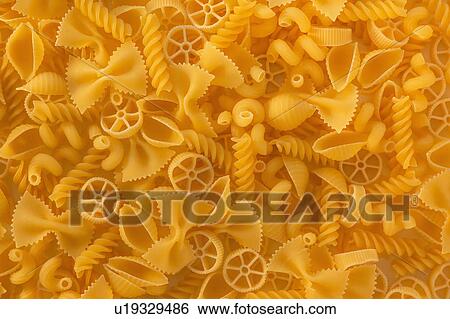 Variety of yellow pasta View Large Photo Image Stock Photograph - Variety of yellow pasta. Fotosearch