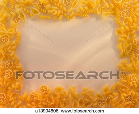 Variety of yellow pasta with blank white space in middle View Large Photo Image Stock Photograph - Variety of yellow pasta with blank white space in middle. Fotosearch