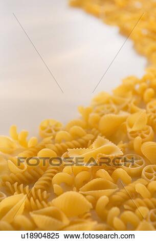 Variety of yellow pasta with blank white space in upper left corner View Large Photo Image Stock Photography - Variety of yellow pasta with blank white space in upper left corner. Fotosearch