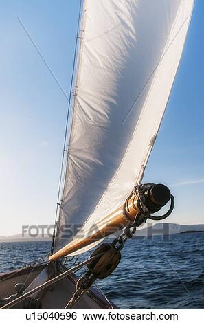 View of sea with yacht bow and sail in foreground View Large Photo Image Stock Photograph - View of sea with yacht bow and sail in foreground. Fotosearch