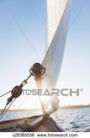 View of sea with yacht bow and sail in foreground View Large Photo Image Stock Photograph - View of sea with yacht bow and sail in foreground. Fotosearch