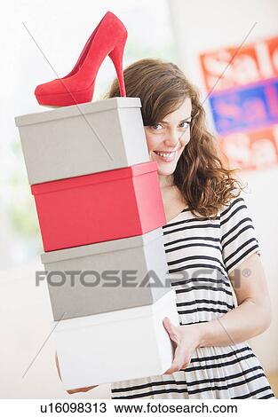 Woman carrying shoes boxes View Large Photo Image Stock Image - Woman carrying shoes boxes. Fotosearch