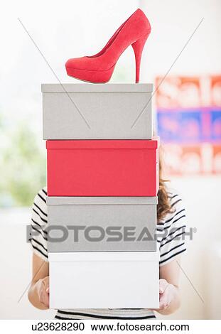 Woman carrying shoes boxes View Large Photo Image Stock Image - Woman carrying shoes boxes. Fotosearch
