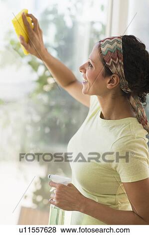 Woman cleaning window View Large Photo Image Stock Photo - Woman cleaning window. Fotosearch