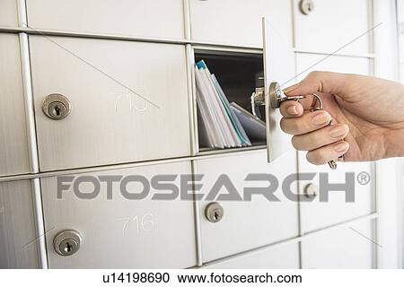 Woman closing safety deposit box View Large Photo Image Stock Image - Woman closing safety deposit box. Fotosearch