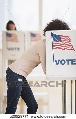 Woman in voting booth View Large Photo Image Stock Image - Woman in voting booth. Fotosearch