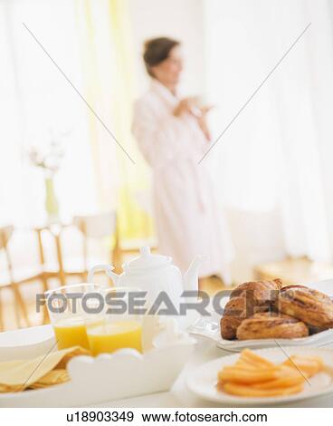 Woman in white robe drinking tea View Large Photo Image Stock Photo - Woman in white robe drinking tea. Fotosearch