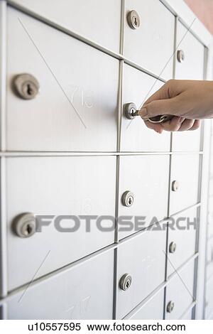 Woman opening safety deposit box View Large Photo Image Stock Photography - Woman opening safety deposit box. Fotosearch