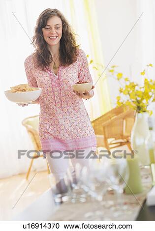 Woman preparing home party View Large Photo Image Stock Image - Woman preparing home party. Fotosearch