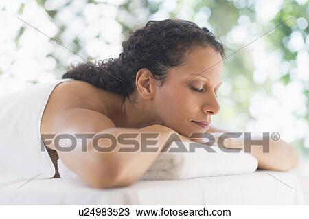 Stock Image - Woman relaxing in spa. Fotosearch