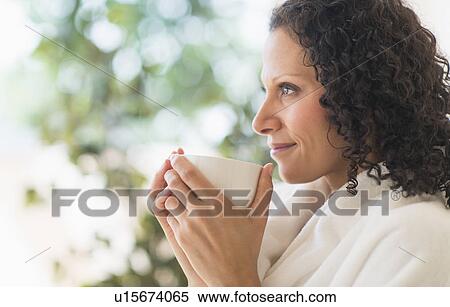 Stock Photography - Woman relaxing with cup of coffee. Fotosearch