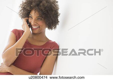 Picture - Woman talking on phone. Fotosearch