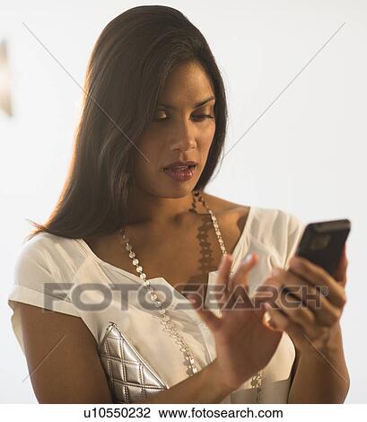 Woman text messaging View Large Photo Image Stock Image - Woman text messaging. Fotosearch