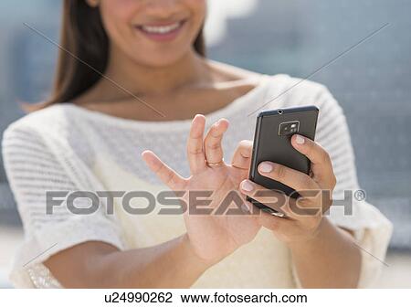 Woman text messaging View Large Photo Image Stock Image - Woman text messaging. Fotosearch