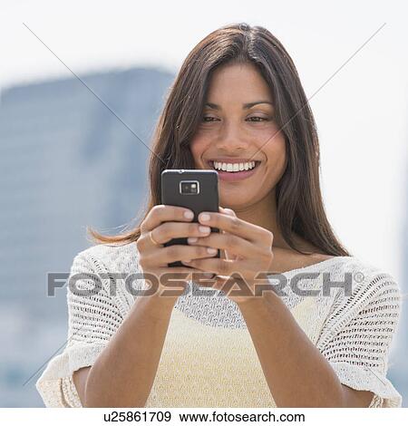 Woman text messaging View Large Photo Image Stock Photo - Woman text messaging. Fotosearch