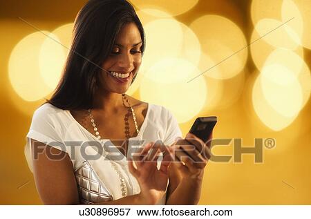 Woman text messaging View Large Photo Image Stock Photo - Woman text messaging. Fotosearch
