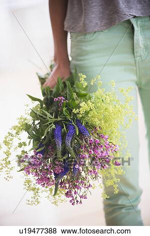 Stock Photo - Woman with bouquet. Fotosearch