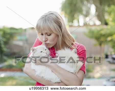 Stock Image - Woman with cat. Fotosearch