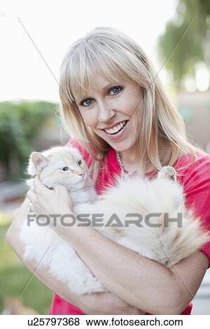 Stock Photo - Woman with cat. Fotosearch