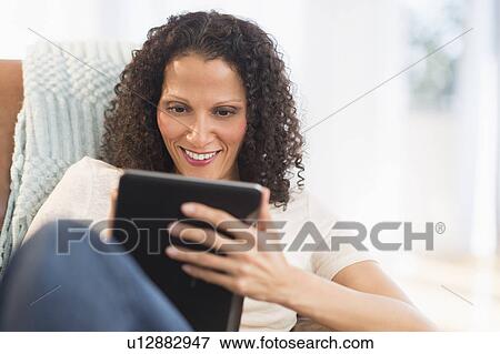Woman with digital tablet View Large Photo Image Stock Photo - Woman with digital tablet. Fotosearch