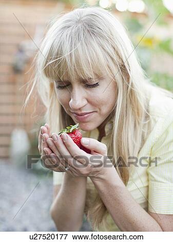 Woman with strawberries View Large Photo Image Stock Photo - Woman with strawberries. Fotosearch
