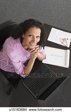 Woman working in office View Large Photo Image Picture - Woman working in office. Fotosearch