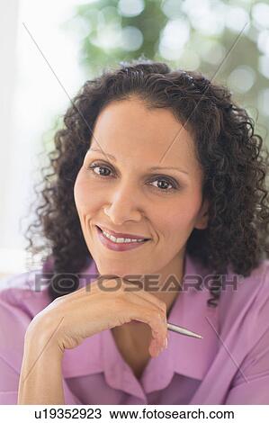 Woman working in office View Large Photo Image Stock Image - Woman working in office. Fotosearch